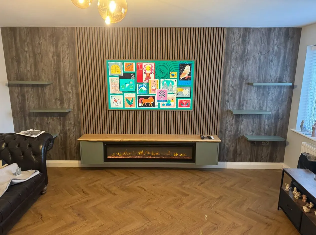Oak feature wall and floating shelf with live-edge top, fitted by Henry Ismond in Lancashire