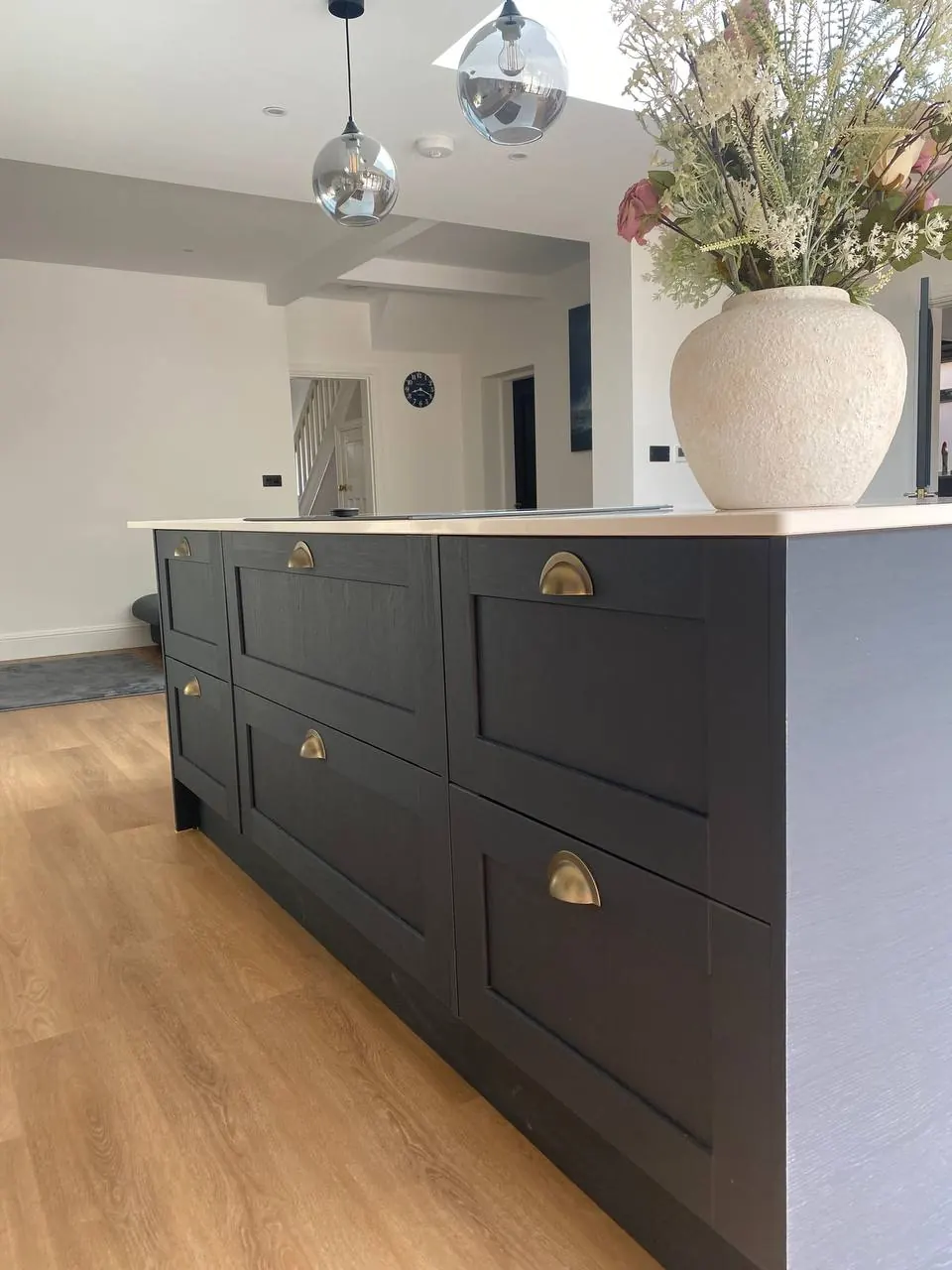 Navy island drawer bank with quartz top and aged-brass cup handles